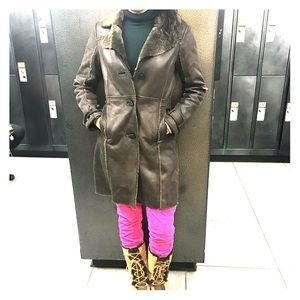 A chocolate shearling coat., designed in Sweden